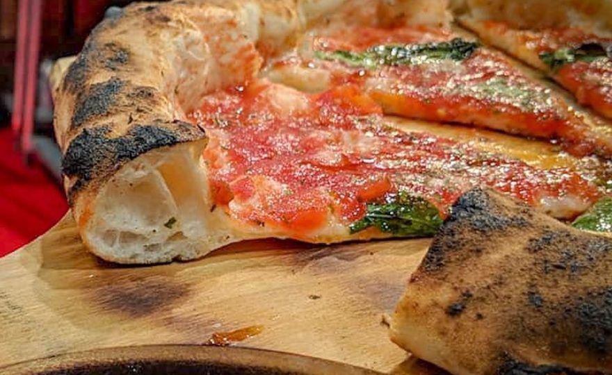 THE RE FIASCONE TOMATO ON THE AWARD WINNING PIZZA